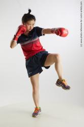 Woman Young Average Fist fight Standing poses Sportswear Asian
